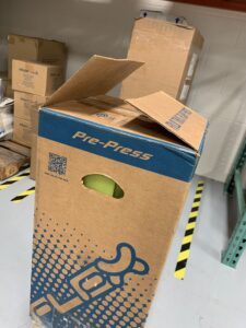 die-cut hand hold in corrugated box